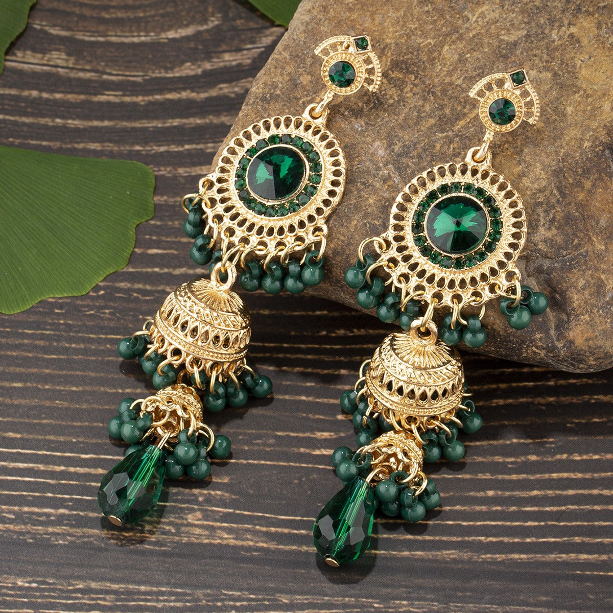 Fashionable and personalized micro diamond earrings Thai retro women's long luxurious imitation large gemstone bell tassel earrings
