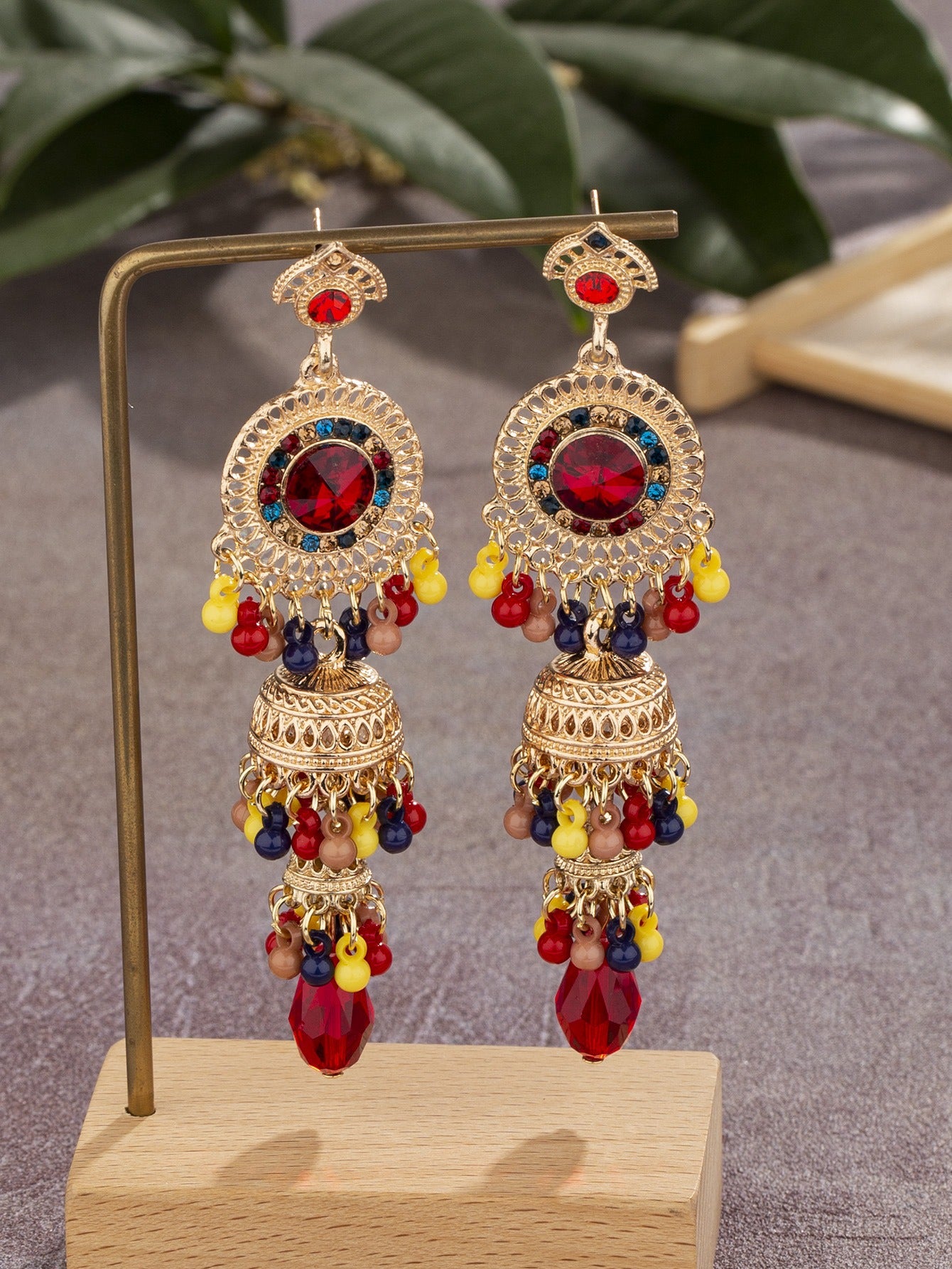 Fashionable and personalized micro diamond earrings Thai retro women's long luxurious imitation large gemstone bell tassel earrings