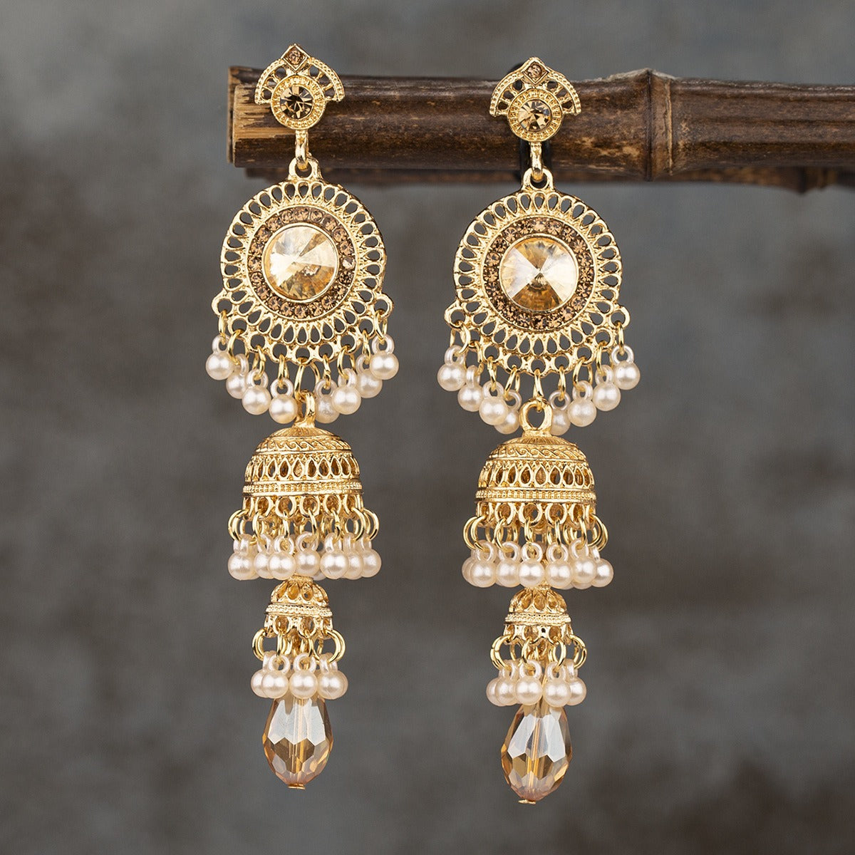 Fashionable and personalized micro diamond earrings Thai retro women's long luxurious imitation large gemstone bell tassel earrings