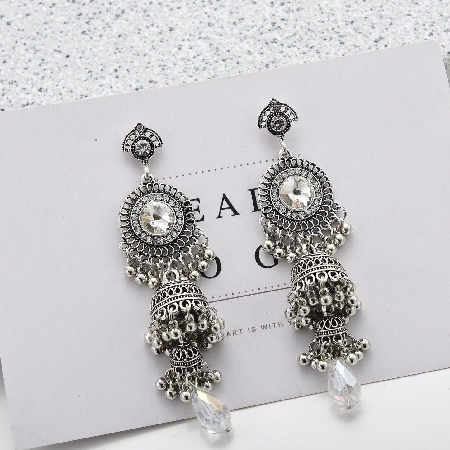 Fashionable and personalized micro diamond earrings Thai retro women's long luxurious imitation large gemstone bell tassel earrings